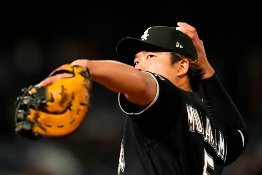 Chicago White Sox first baseman Munetaka Murakami throws a ball...