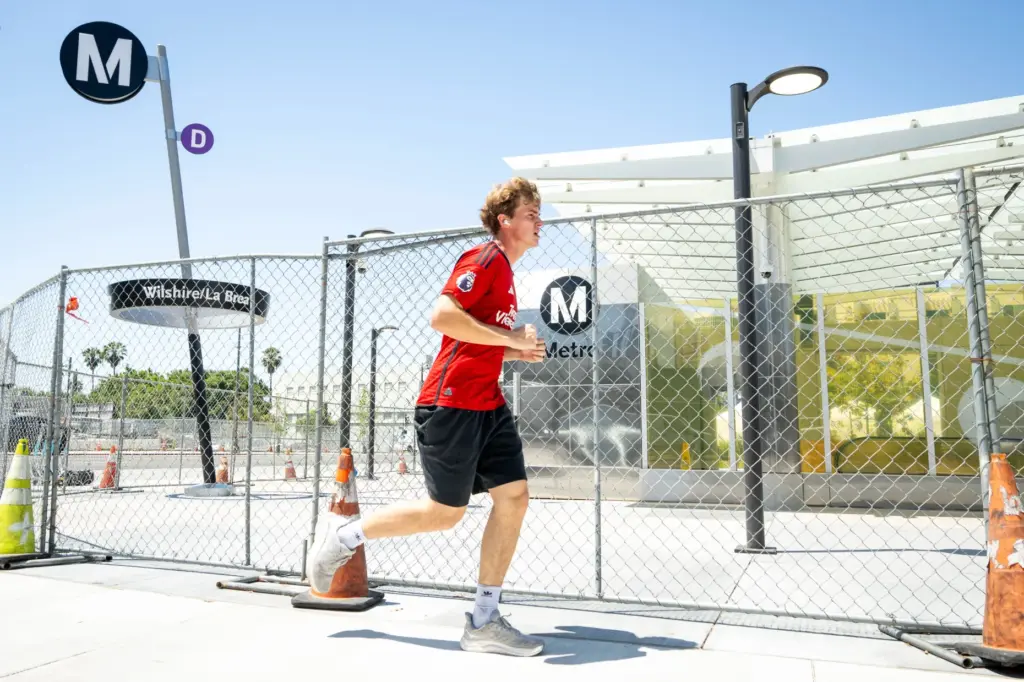 A runner passes the Metro D Line subway extensionâs Wilshire/La...