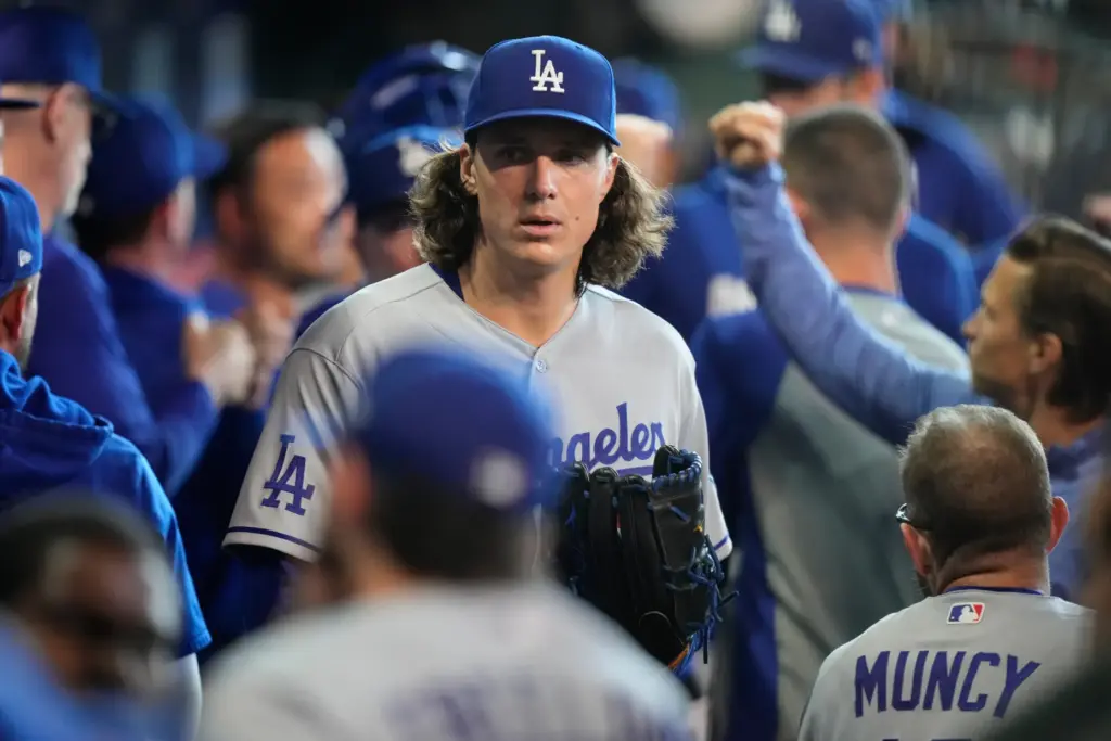 Dodgers starting pitcher Tyler Glasnow enters the dugout before a...