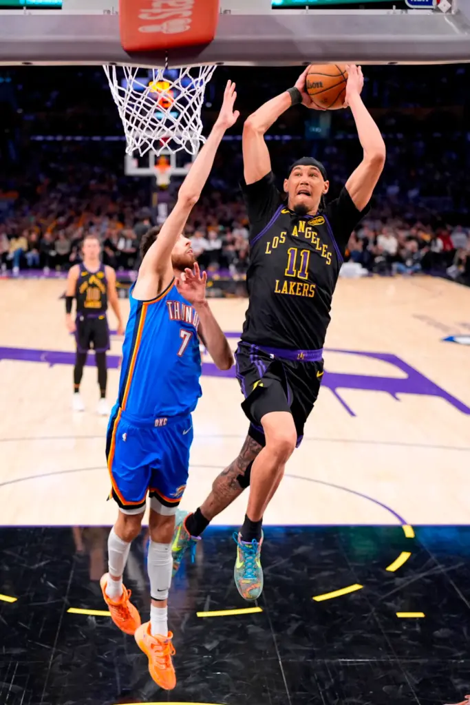Lakers center Jaxson Hayes, right, shoots as Oklahoma City Thunder...