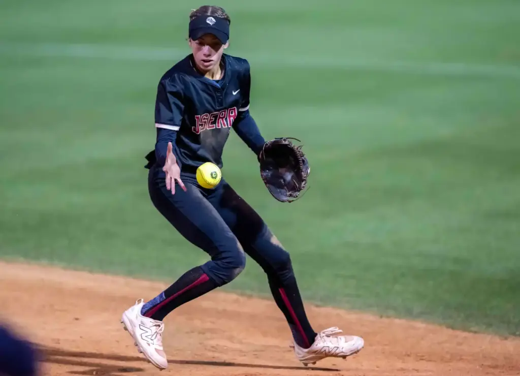 JSerra second baseman Ava Born tries to field, but bobbles...
