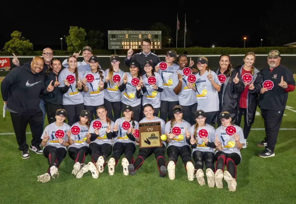 JSerra players and coaches celebrate with their CIF patches after...