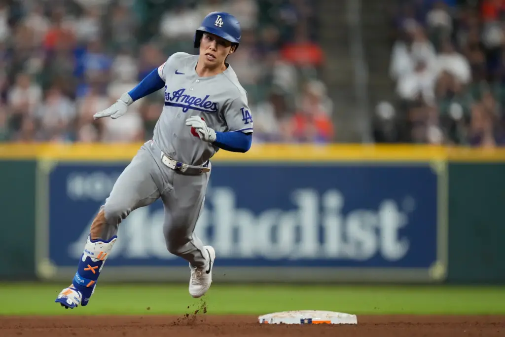 The Dodgers’ Hyeseong Kim rounds second on a triple during...