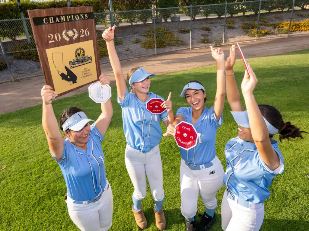 Irvine players celebrate the teamsâ 15-2 win over Arroyo during...