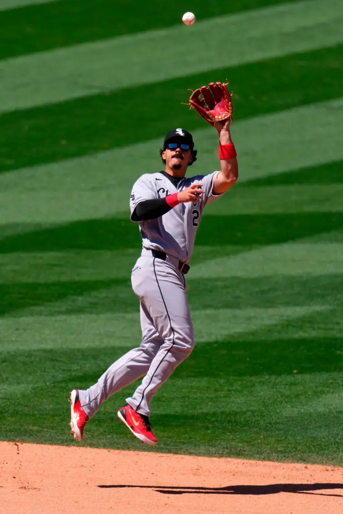 Chicago White Sox third baseman Miguel Vargas makes a catch...