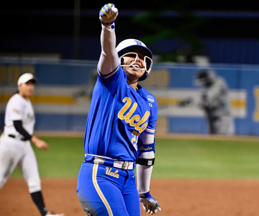 Bri Alejandre #22 of the UCLA Bruins reacts after hitting...
