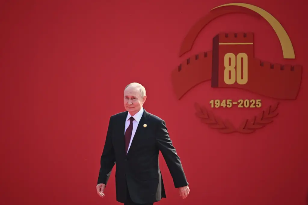 Russian President Vladimir Putin arrives at a military parade.