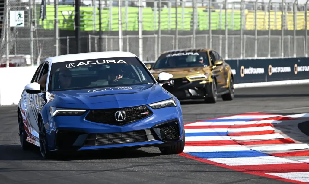 Race fans participate in the VIP track activities during the...