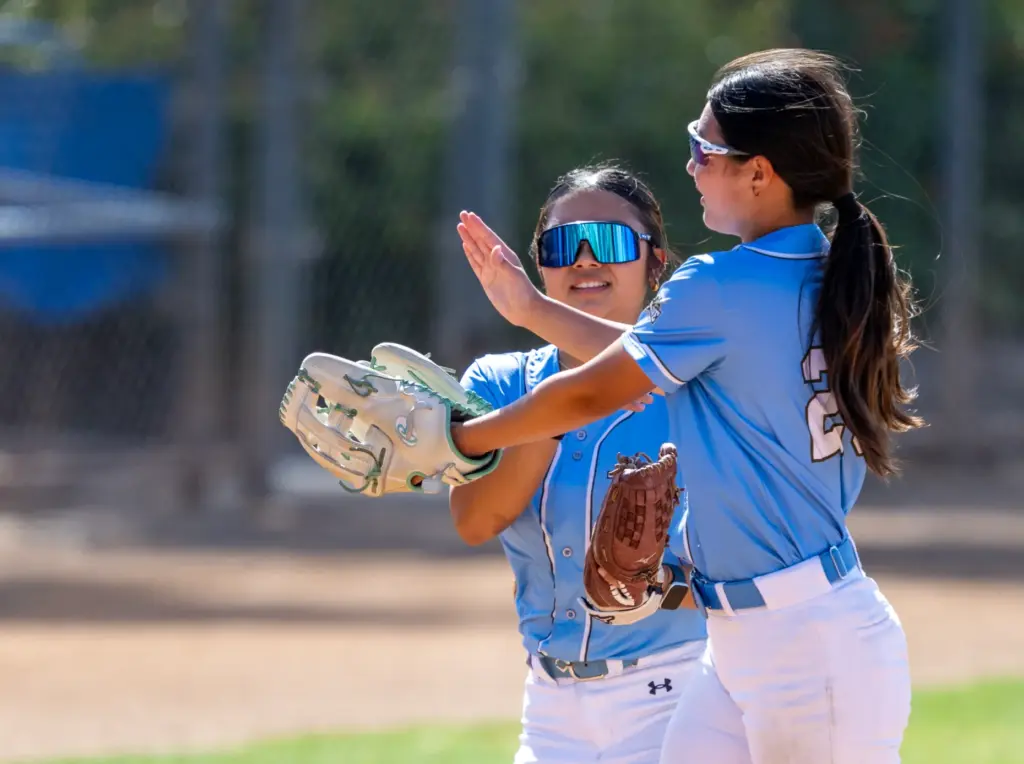 Irvine left fielder Eva Cho, left, and center fielder Shelley...