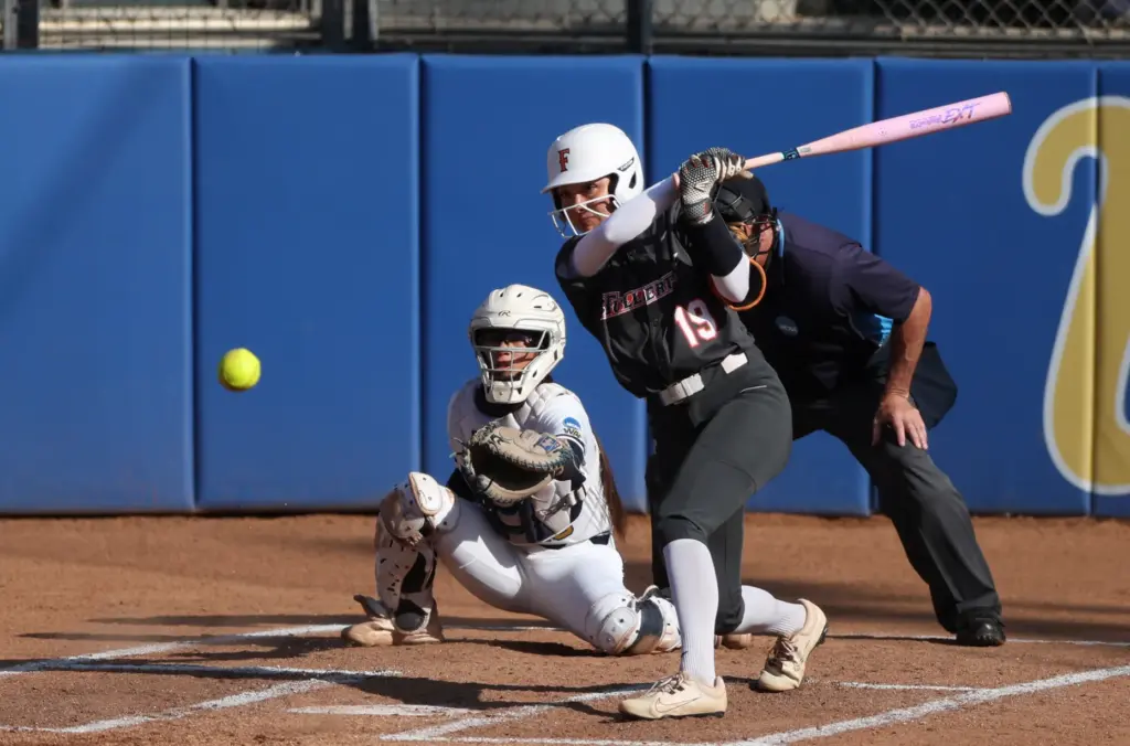 Cal State Fullertonâs Colby McClinton (19) makes contact while at-bat...