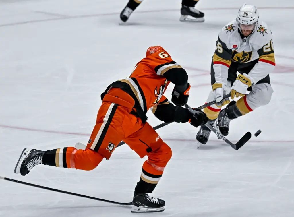 The Ducksâ Tyson Hinds, left, takes a shot on goal...