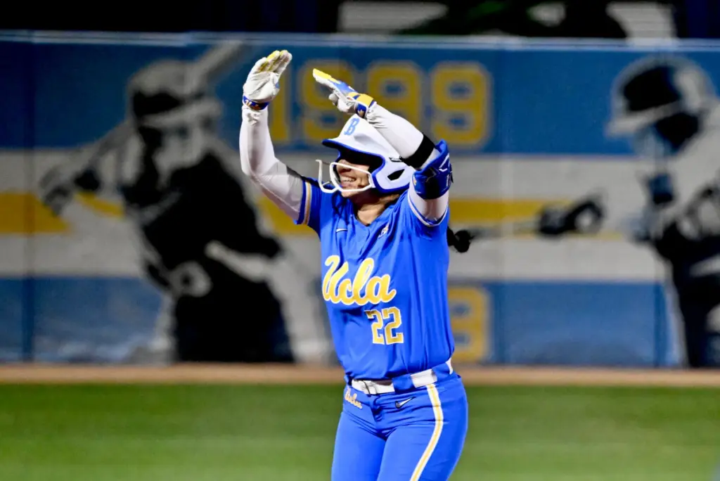 Bri Alejandre #22 of the UCLA Bruins reacts after hitting...