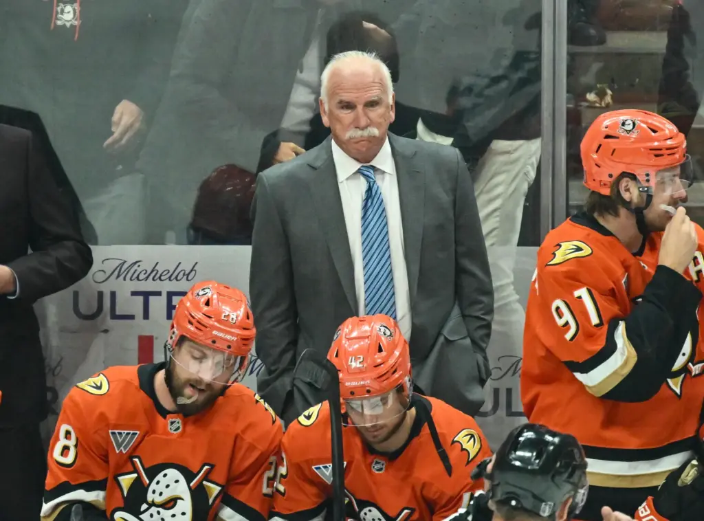 Ducks head coach Joel Quenneville looks on from the bench...