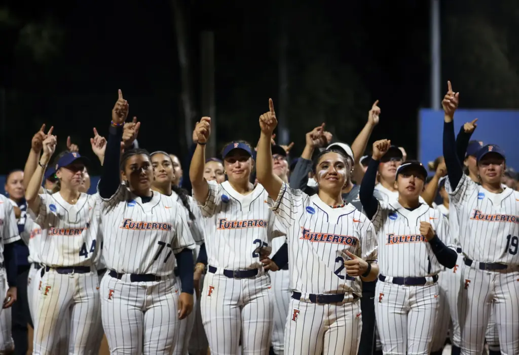 Cal State Fullerton points to their fans in support after...