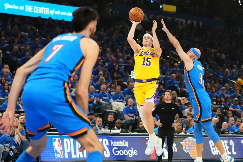 Lakers guard Austin Reaves (15) shoots as Oklahoma City Thunder...