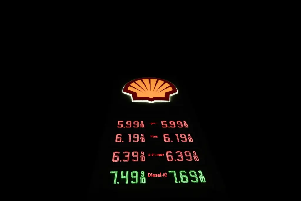 Gas prices are shown at a Shell gas station in...