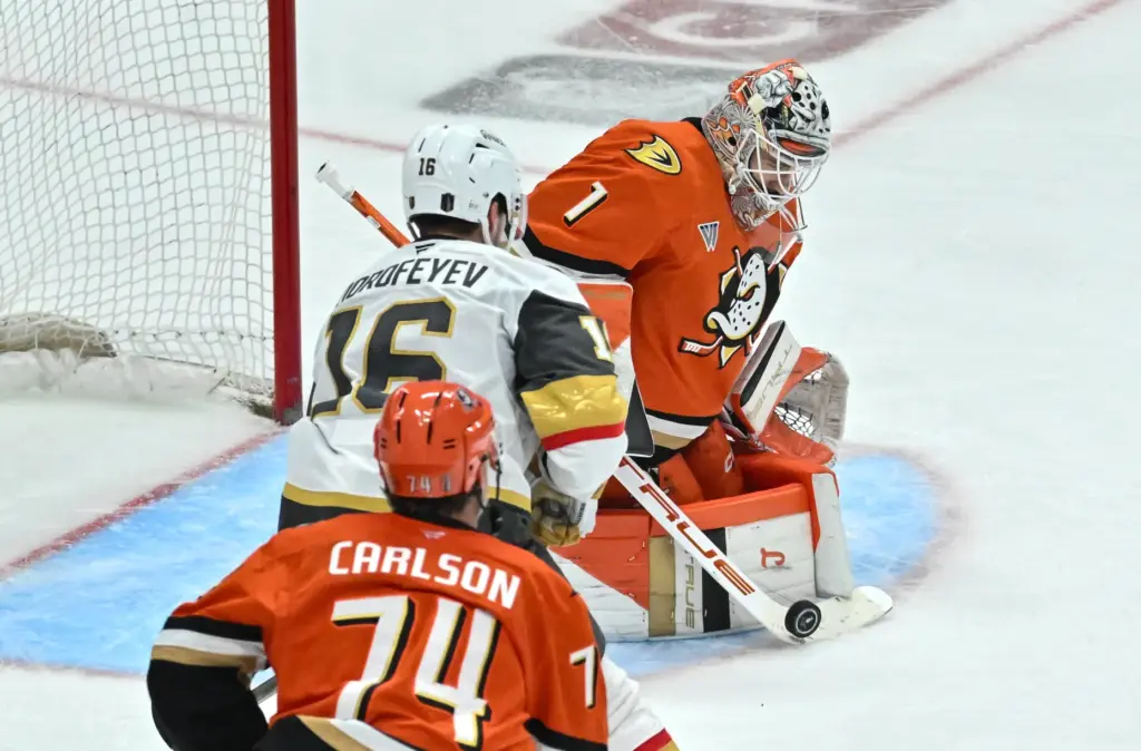 Ducksâ goalie Lukas Dostal (1) blocks a shot from the...