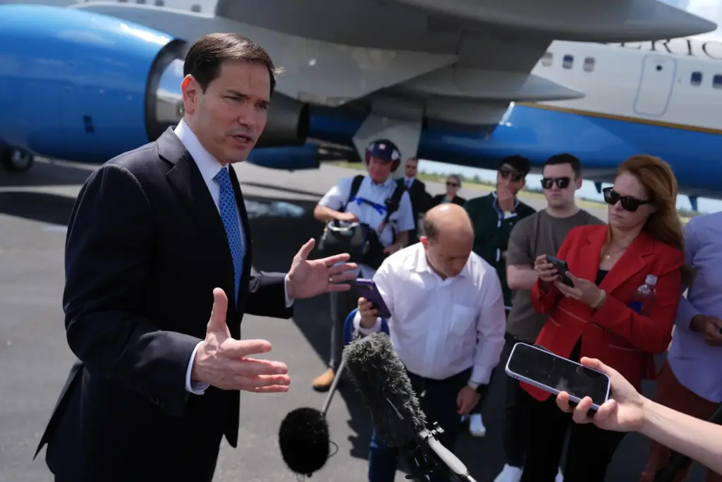 Secretary of State Marco Rubio speaks to the press before boarding his plane.