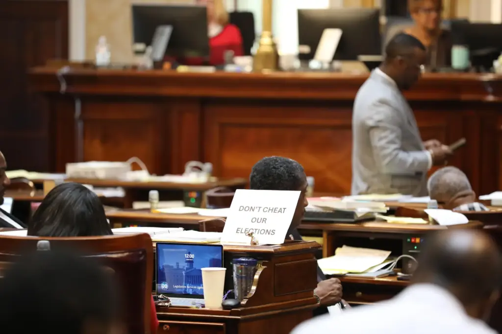 A sign sits on the desk of Democratic South Carolina Rep. Annie McDaniel reading 