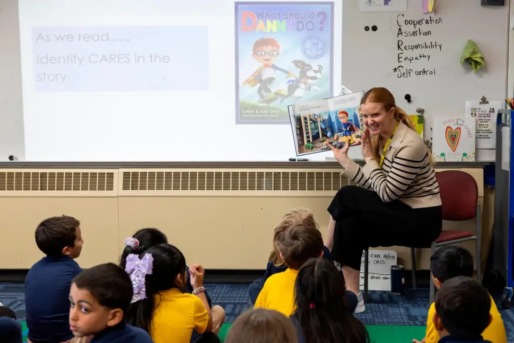 Media specialist Alison Kimble reads to her class at Valley...