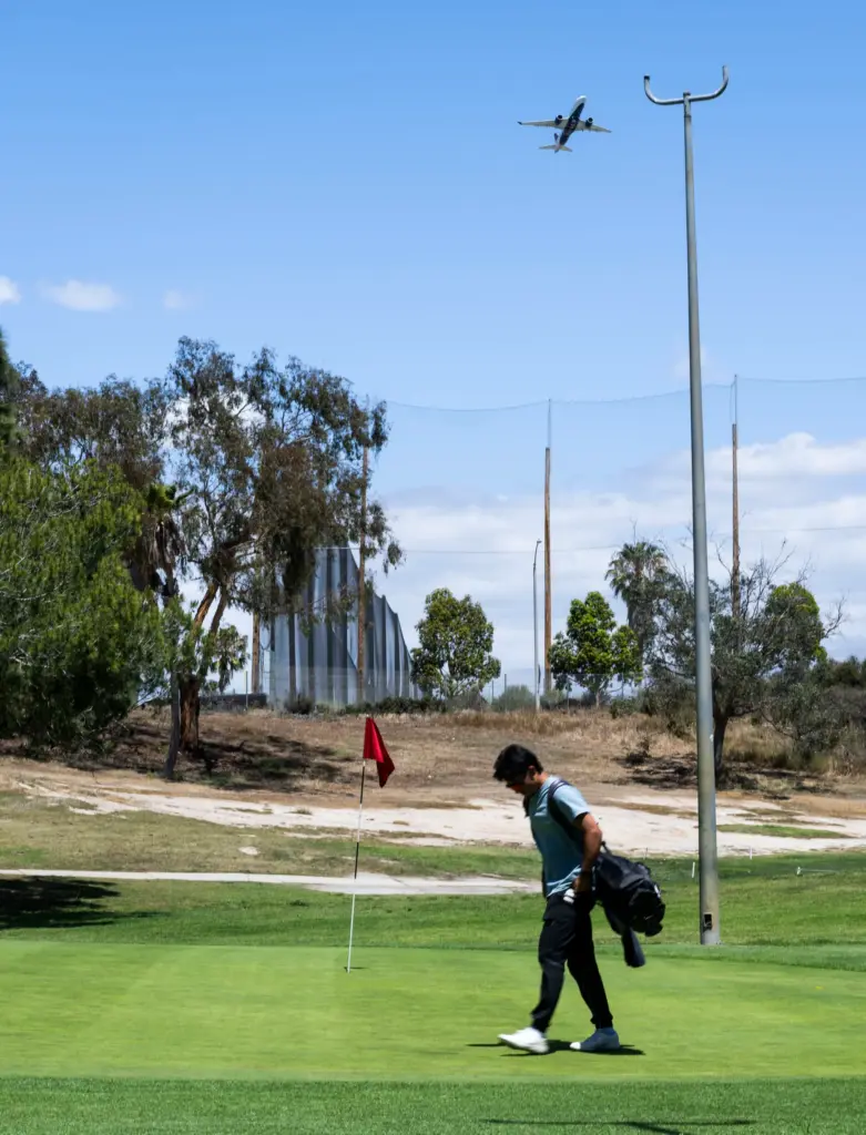 A golfer finishes hole 7 at Newport Beach Golf Course...