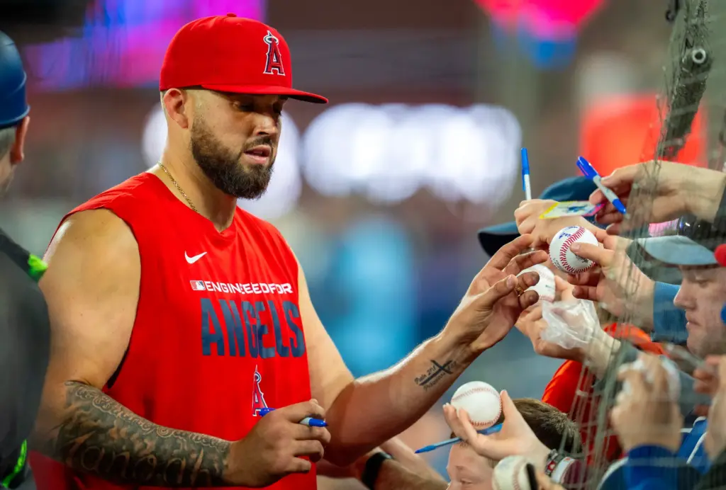 Angels pitcher Alek Manoah signs autographs for fans before a...