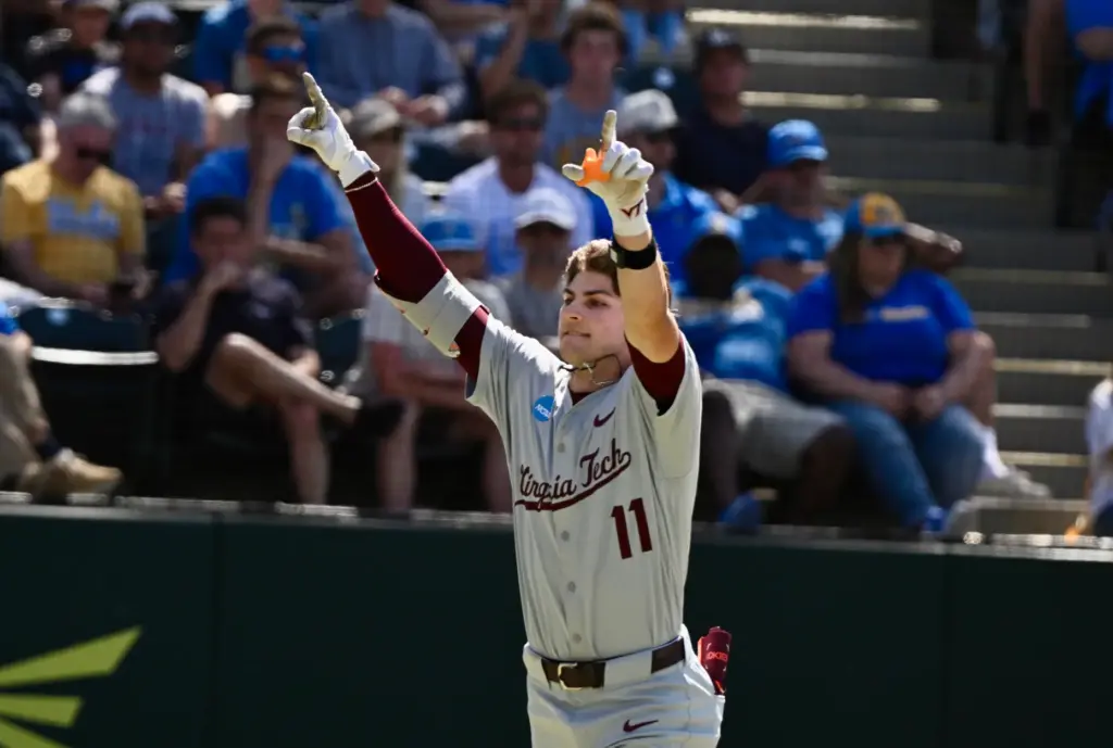 Ethan Gibson #11 of the Virginia Tech Hokies reacts after...
