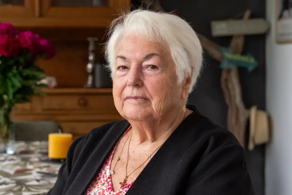 Marie-Therese Ross-Mahe, an 85-year-old French widow of a U.S. military veteran, poses in Orvault, France.