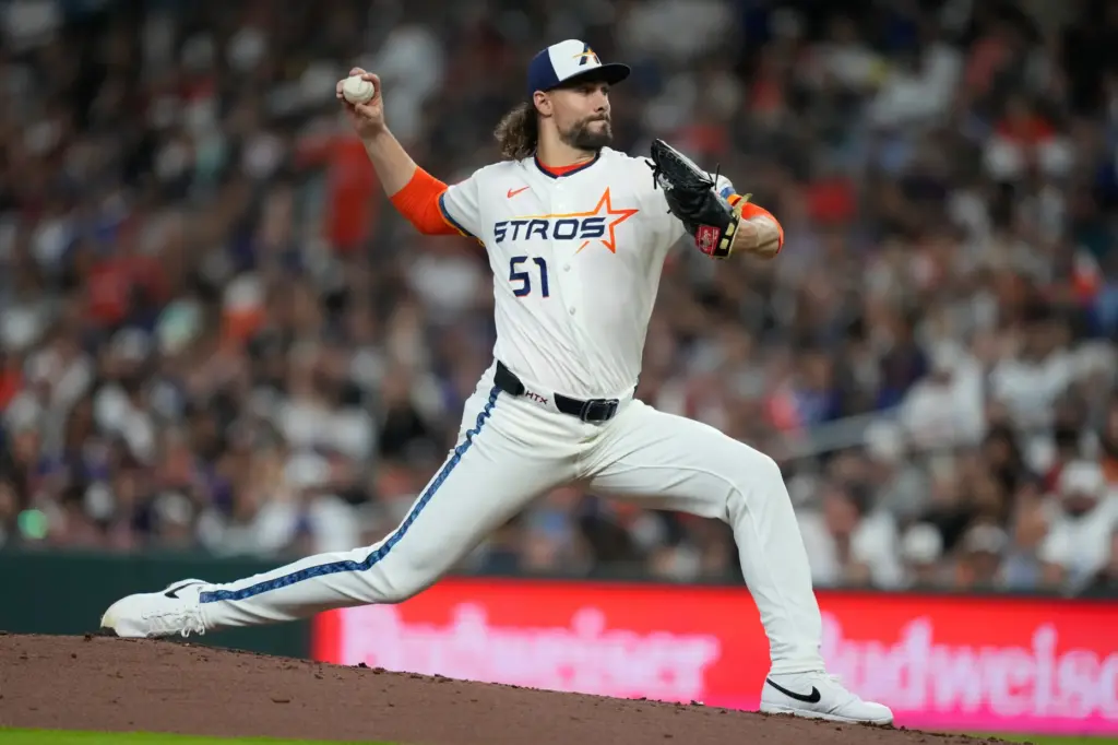 Houston Astros relief pitcher Ryan Weiss throws during the second...