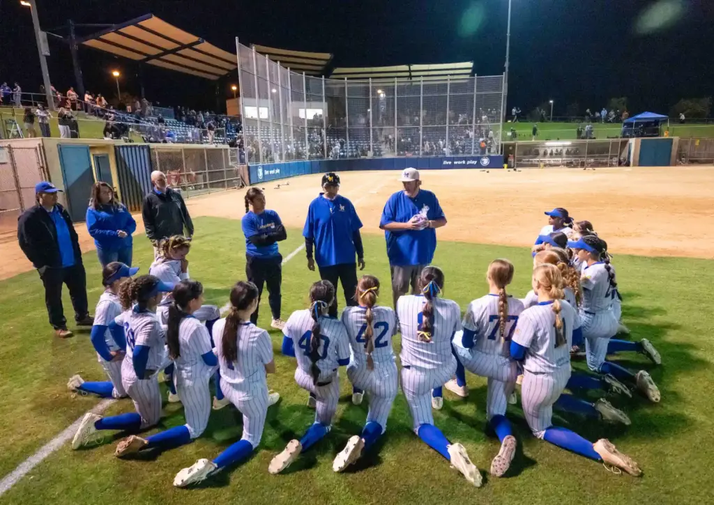 La Mirada players listen to words of encouragement from their...