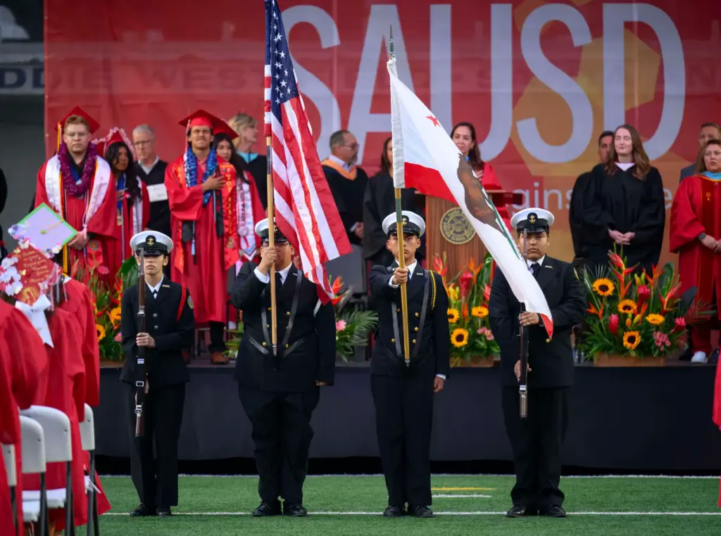 The Santa Ana High School NJROTC Color Guard presents the...