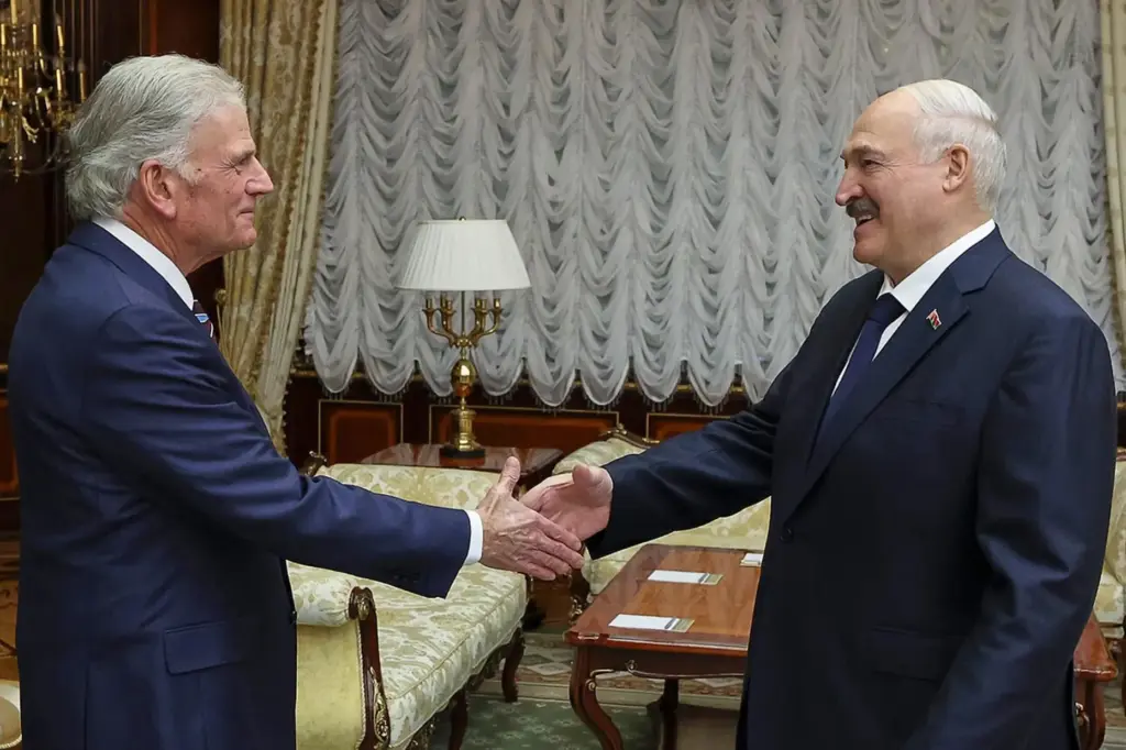 Belarusian President Alexander Lukashenko, right, and U.S. evangelist Franklin Graham shake hands