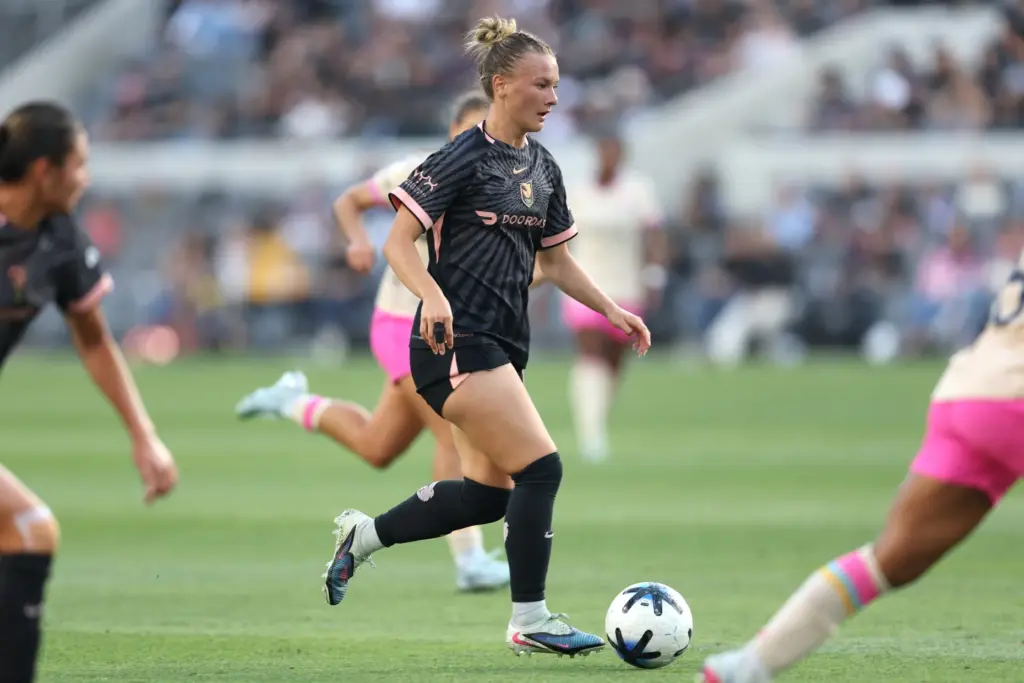 Angel City FC midfielder Kennedy Fuller moves the ball against...