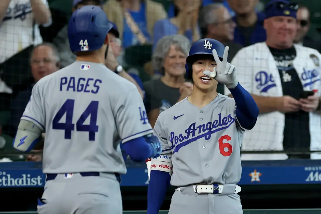 The Dodgers’ Andy Pages, left, is congratulated by teammate Hyeseong...