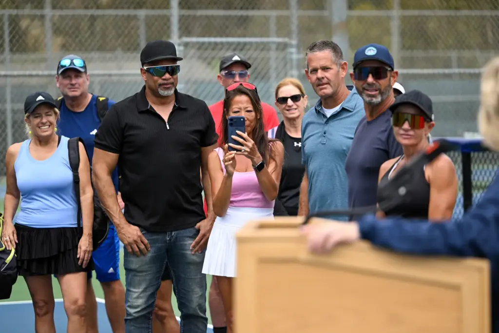 Pickleball players watch as officials OC announce the opening of...