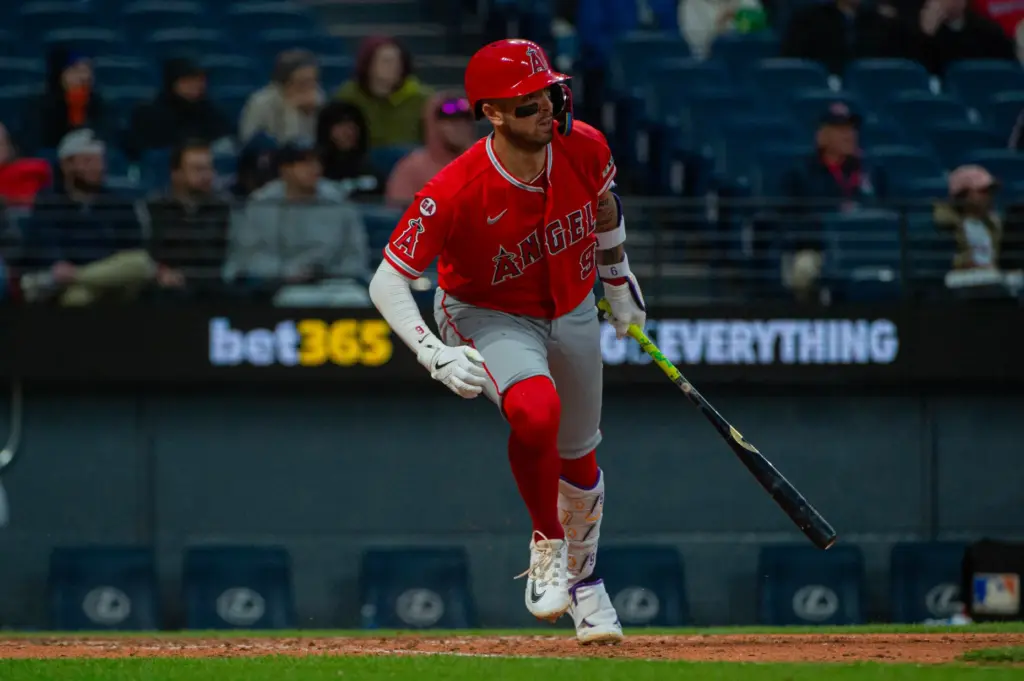 The Angels’ Zach Neto begins to run as he watches...