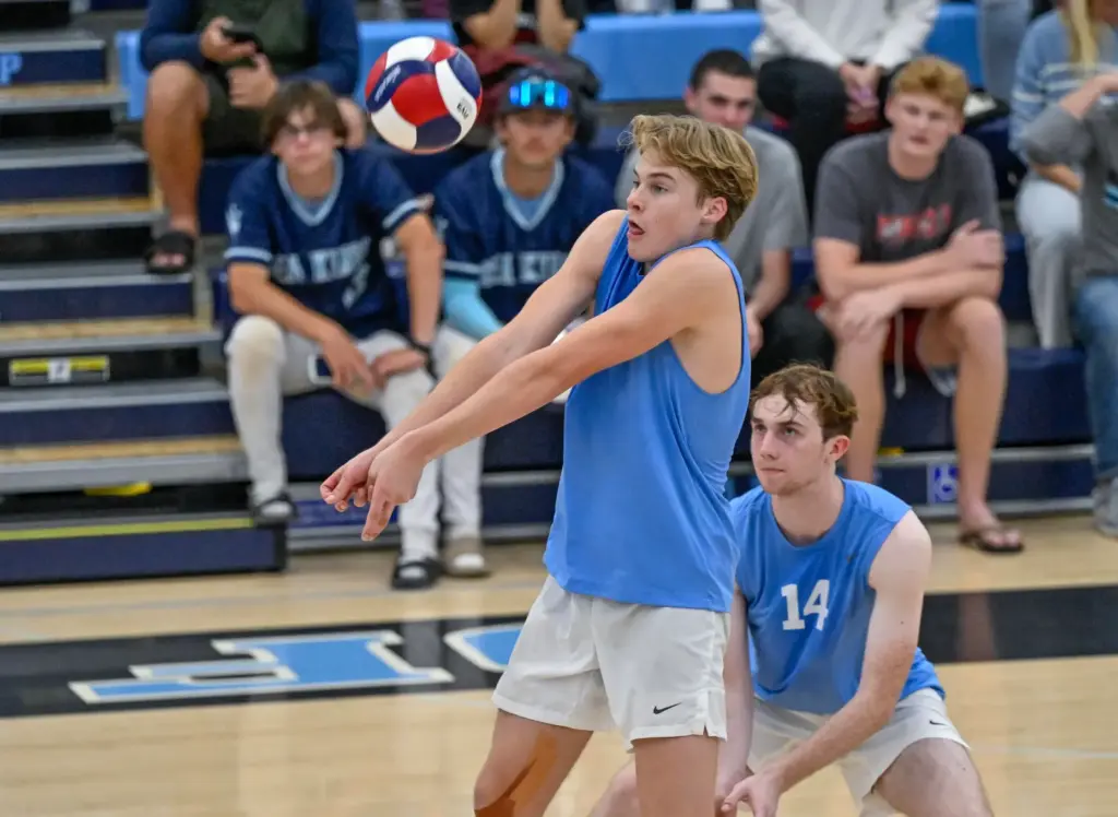 Corona del Mar setter Drake Foley digs the ball during...