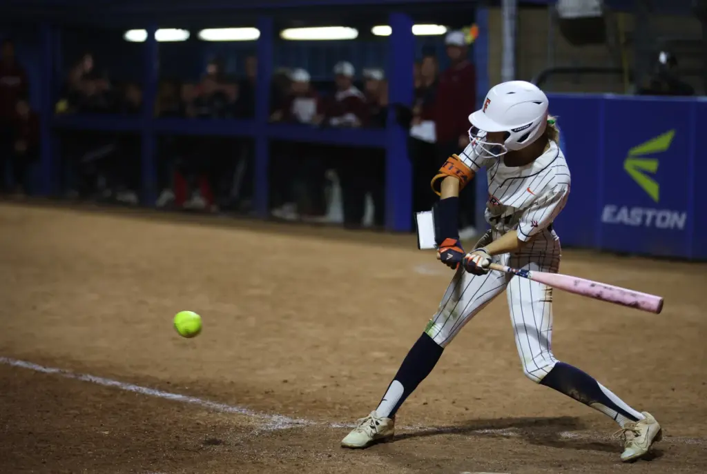 Cal State Fullertonâs Kate Verhoef swings at a pitch during...