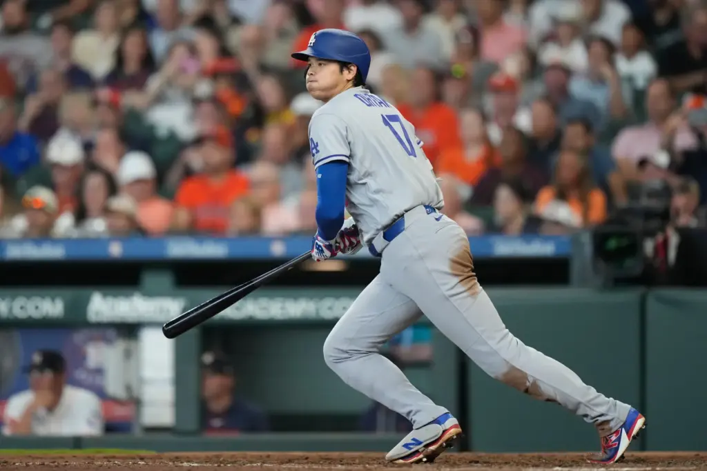 Dodgers star Shohei Ohtani hits a single during the fifth...