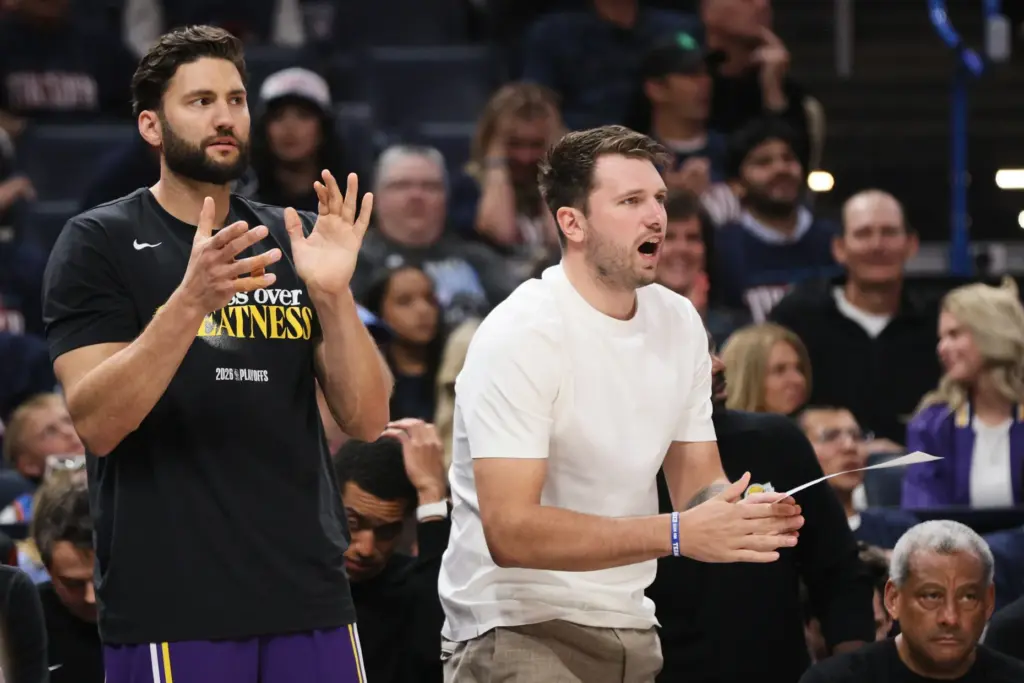 Los Angeles Lakers’ Maxi Kleber, left, and Luka Doncic, right,...