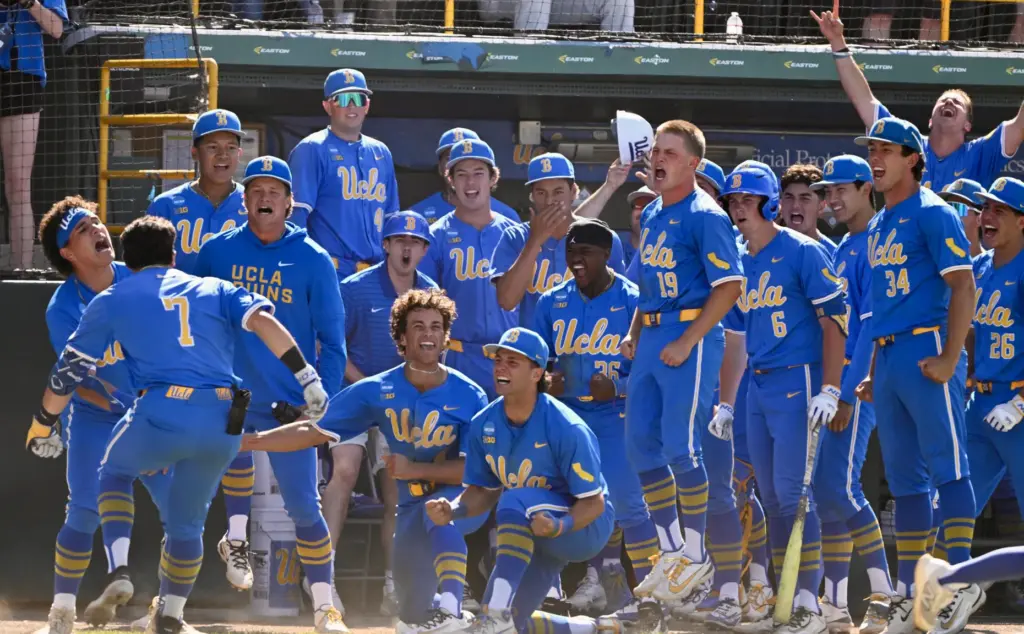 Roman Martin #7 of the UCLA Bruins celebrates with teammates...