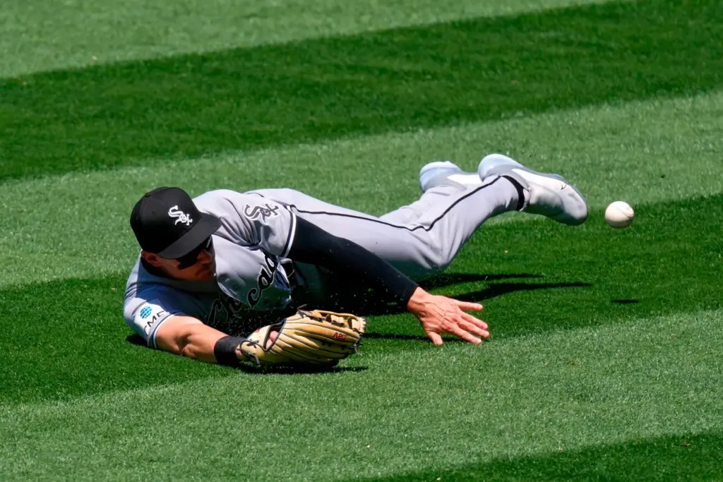Chicago White Sox right fielder Jarred Kelenic can’t get to...