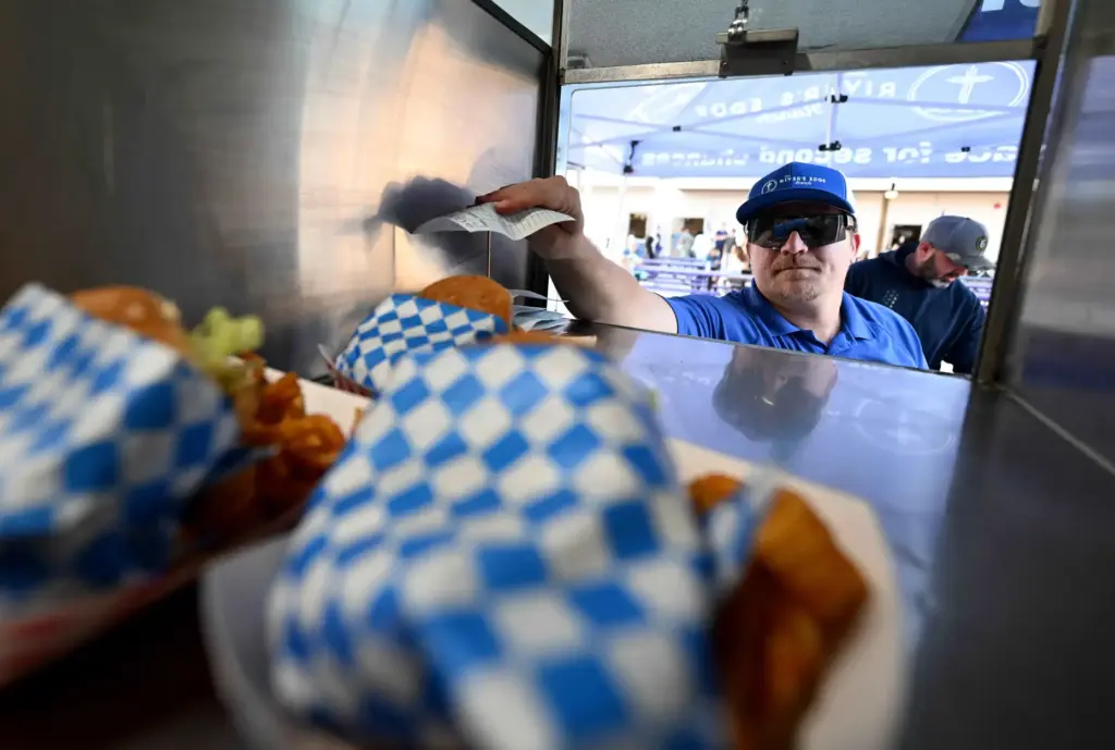 River’s Edge Ranch ârancherâ Brandon Paul prepares to deliver a...