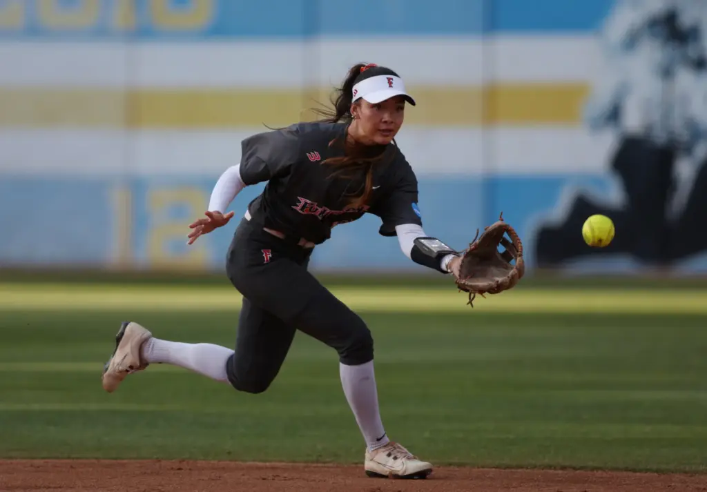 Cal State Fullertonâs Colby McClinton reaches for a hopping ground...