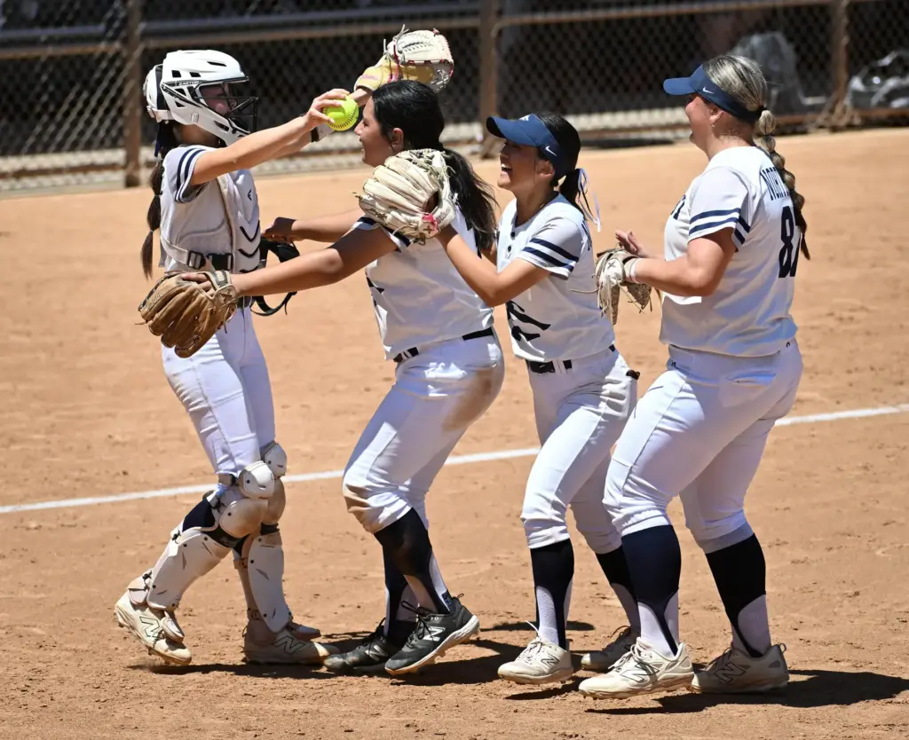 Northwood pitcher Olivia Chen and catcher Marissa Lee embrace after...