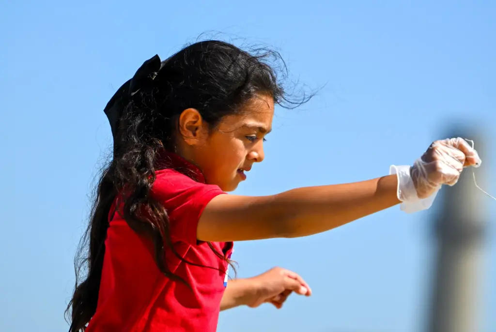 Abigail Alvarado, from Handy Elementary School, finds a small piece...
