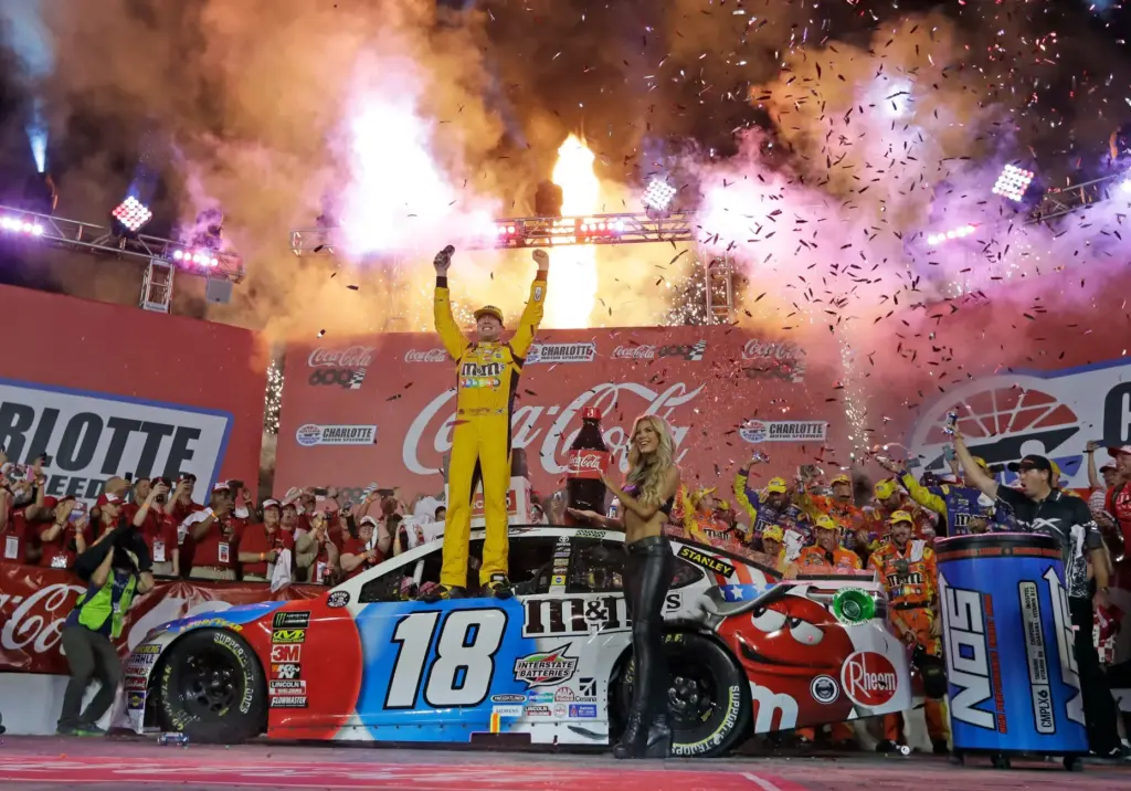 Kyle Busch celebrates after winning the NASCAR Cup Series auto race.