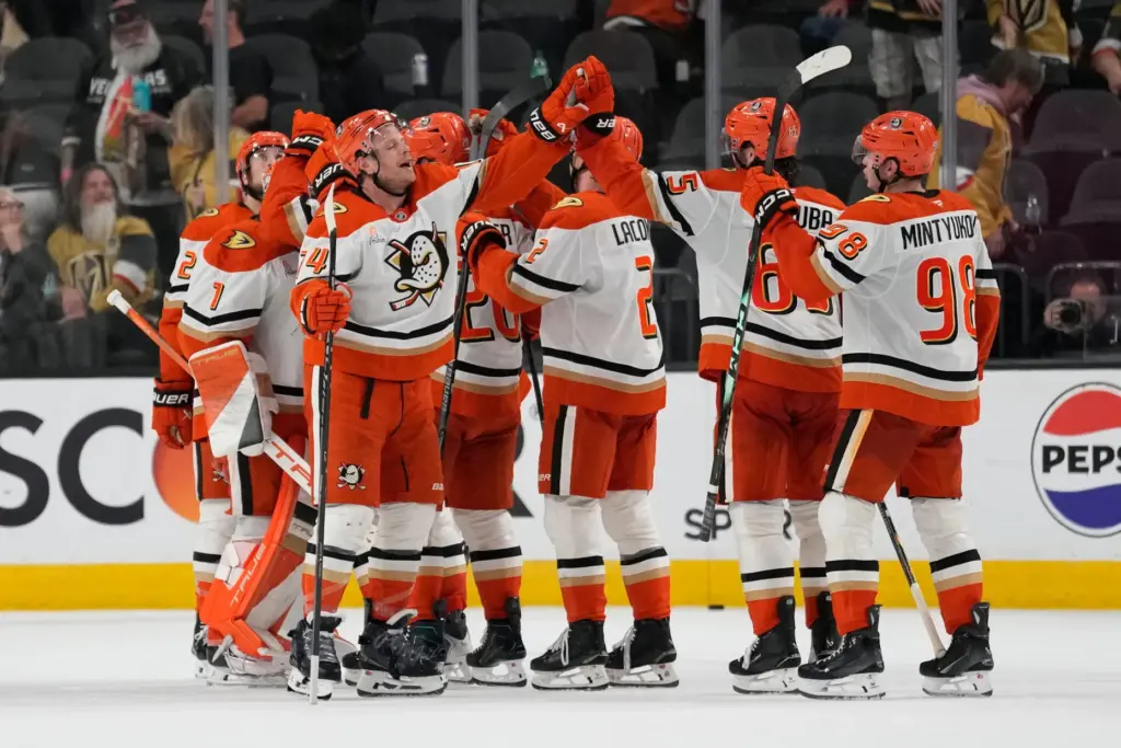 Ducks players celebrate after defeating the Vegas Golden Knights in...