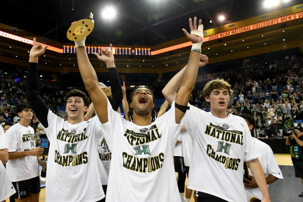 Hawaii players, including tournament MVP Louis Sakanoko, center, celebrate after...