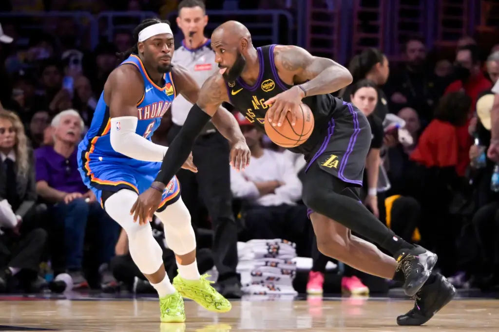 Lakers star LeBron James drives as the Oklahoma City Thunder’s...